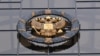 RUSSIA -- A statue of Themis, an ancient Greek Goddess of Justice, and a Russian national state emblem are seen at the entrance of Russia's Supreme Court in Moscow on November 30, 2023