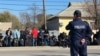 Kazakhstan - Police monitor migrants who stand near the court building. Turkistan region 4 Nov, 2023