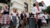 BELARUS -- People sing as they attend an opposition demonstration to protest against presidential election results in front of the Janka Kupala National Academic Theatre, in Minsk, August 20, 2020