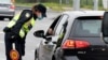 Croatia - Police check vehicles at an entry point to Zagreb on March 24, 2020 as authorities set up a lockdown to home residence in a bid to curve the spead of the COVID-19 infection caused by the novel coronavirus.