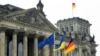 GERMANY – The EU, Ukraine and Germany's flags wave outside the Reichstag building, on the day Ukraine's President Volodymyr Zelenskiy addresses the lower house of parliament, the Bundestag, via videolink, after Russia's invasion of Ukraine, in Berlin, Mar