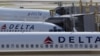 U.S. -- Delta Airlines planes are parked at gates at Ronald Reagan Washington National Airport in Washington, August 8, 2016